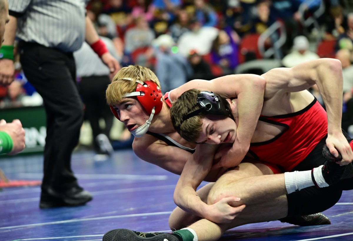Akron-Westfield's Cael Morrow (left) tries to control Luke Guseman during a 120-pound semifinal match during the IHSAA state tournament at Wells Fargo Arena in Des Moines on Thursday.(Photo by Ryan Tiimmerman)